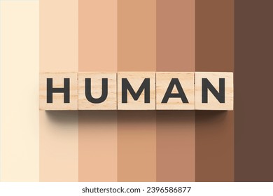 Human wooden cubes on background with different skin tones