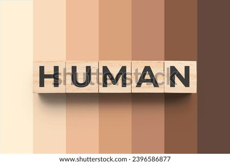 Human wooden cubes on background with different skin tones