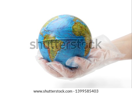 The humanhand in plastic glove holds the planet earth. The concept of protecting the earth from ecological disaster. Isolated white background.