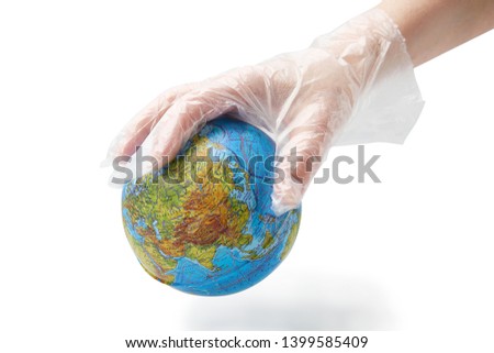 The humanhand in plastic glove holds the planet earth.  Isolated white background.