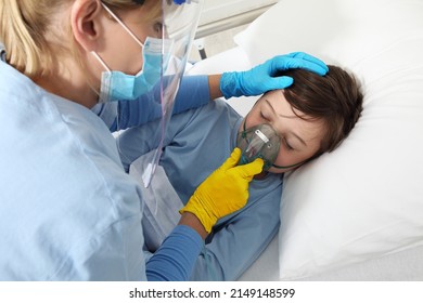 Humanitarian Aid, Help For Medical Protection For Ukraine War, Doctor Put Oxygen Mask To Patient Child In Hospital Bed, Yellow And Blue Gloves Colors Of The Flag Of Ukraine. Injured Ukrainian Refugees