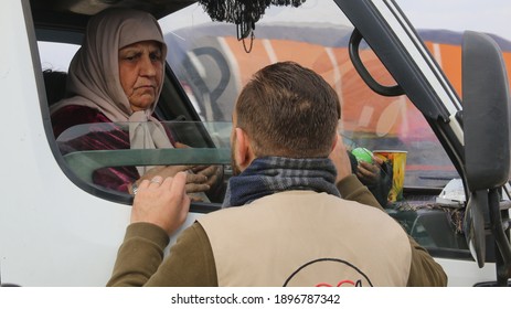 A Humanitarian Aid Worker With An Elderly Refugee Woman.
Aleppo, Syria 17 April 2018