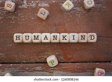 Humankind word written on cube shape wooden blocks on wooden table. - Shutterstock ID 1260008146