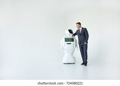 Humanoid autonomous robot with stylish man in a suit. Modern Robotic Technologies. Humanoid autonomous robot. white background