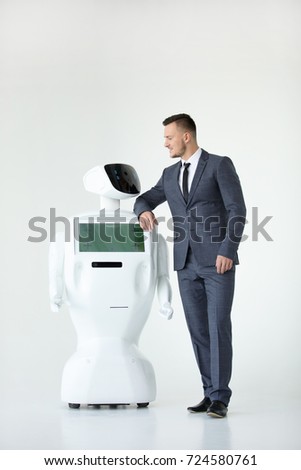 Humanoid autonomous robot with stylish man in a suit. Modern Robotic Technologies. Humanoid autonomous robot. white background