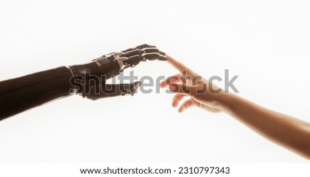 Humanoid Robot Arm Touches Child's Human Hand. Humanity and Artificial Intelligence Unified. Future Generation Embracing Technology, Making Contact. Inspired by Michelangelo's Creation of Adam