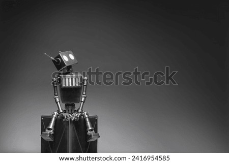 Humanoid robot on a dark background. Concept of the future of artificial intelligence and the fourth industrial revolution.