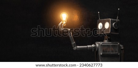 Humanoid robot with a paw in his hand on a black background. The concept of the future of artificial intelligence and the 4th fourth industrial revolution.
