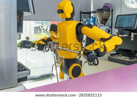 Humanoid robot prepares coffee using automatic coffee machine in Shenzhen, China. Artificial intelligence, robotics, service automation, smart hospitality, autonomous machines and future food service technology
