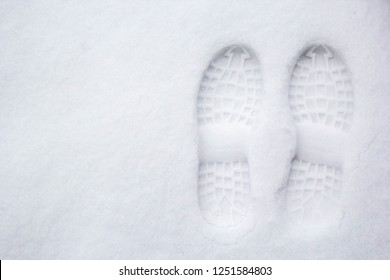 Human's Footprint On A First White Snow, Top View