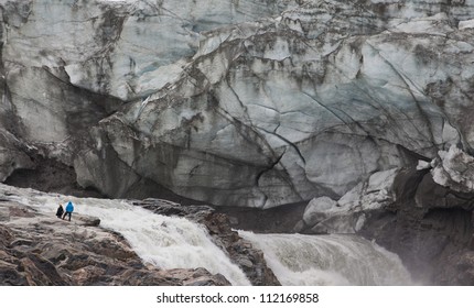 Humans in front of melting glacier, Kangerlussuaq, Greenland - Powered by Shutterstock