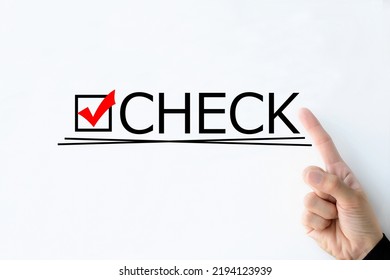 Human's hand pointing at "CHECK" word on whiteboard - Shutterstock ID 2194123939