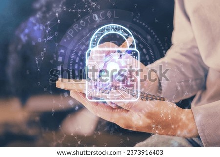 Human's hands with cyber security theme multi exposure background drawings. Concept of online protection.