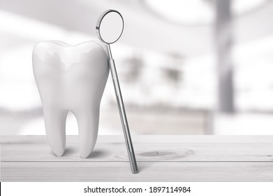 Human's White Tooth And Dentist Mirror