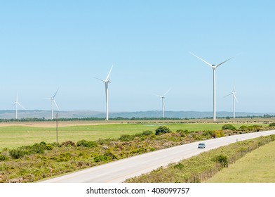 HUMANSDORP, SOUTH AFRICA - FEBRUARY 28, 2016:  The N2 National Road Near Humansdorp With Wind Driven Turbines And Cattle In The Back