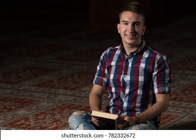 Humble Muslim Man Is Reading The Koran In The Mosque