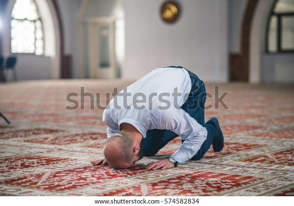 muslim praying on knees