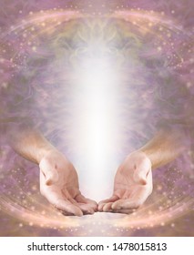 Humble Pranic Healer Message Board - male hands in open giving position with shaft of white light above on a pink peach ethereal energy flowing sparkling background with copy space
