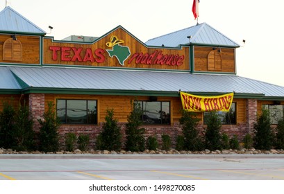 Humble, Texas USA 09-06-2019: Texas Roadhouse Restaurant Exterior In Humble, TX With A Hiring Sign Out Front. Founded In 1993 It's Known For Great Steak And Free Peanuts In Buckets.