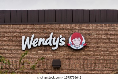 Humble, Texas USA 11-28-2019: Wendy's Fast Food Restaurant Facade In Humble, TX. Side Exterior Wall And Sign. Established In 1969 They Serve A Variety Of Food Including The Frosty.