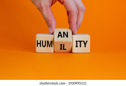 Humility Vs Humanity Symbol. Businessman Turns Cubes And Changes The Word 'humility' To 'humanity'. Beautiful Orange Table, Orange Background, Copy Space. Business And Humility Vs Humanity Concept.