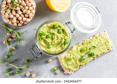 Hummus. Green pea hummus with chickpeas and green peas, olive oil. Middle east food, vegan, vegetarian snack. Top view. Copy space - Powered by Shutterstock