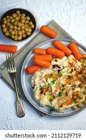 Hummus With Olive Oil And Baby Carrots On A Plate.