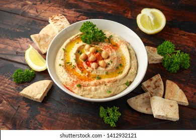 Hummus With Olive Oil, Paprika, Lemon And Pita Bread