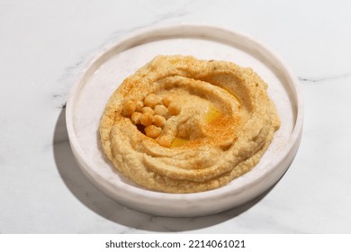 Hummus On A White Plate