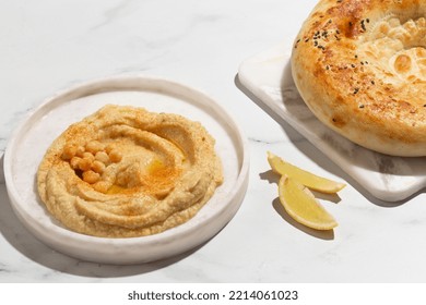 Hummus On A White Plate