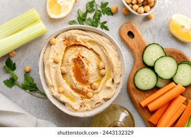 Hummus with paprika with celery, carrots, cucumber, with chickpeas and olive oil, healthy lunch food