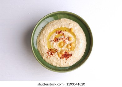 Hummus plate, top view, isolated on white, humus