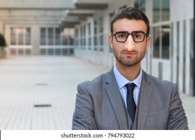 Humorous Businessman Wearing A Disguise 