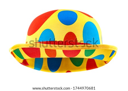 Humorous headgear concept with floating clown bowler hat in red, blue, green and yellow colors  isolated on white background with clipping path cutout using the ghost mannequin technique