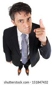 Humorous High Angle Portrait Of A Dogmatic Businessman Glaring At The Camera And Pointing His Finger As He Stresses His Authority And Point Of View