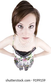 Humorous Photo Of A Confused Or Shocked Brunette Woman Through A Fisheye Lens With Hands On Hips. Isolated On White.