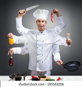 Humorous portrait of a chef with many hands on gray background