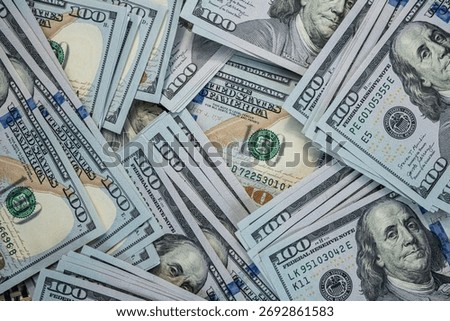 Hundred dollar banknotes background representing financial stability, banking and currency concept
