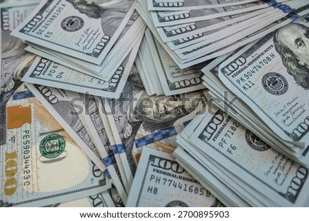 Hundred dollar banknotes background representing financial stability, banking and currency concept