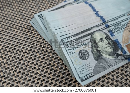 Hundred dollar banknotes background representing financial stability, banking and currency concept
