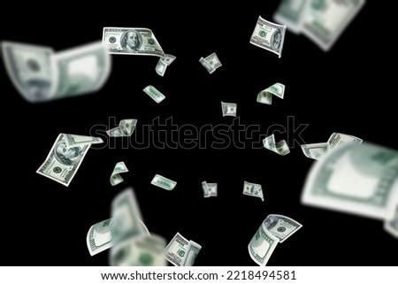 Hundred dollar bill. Falling money isolated on black background. American cash