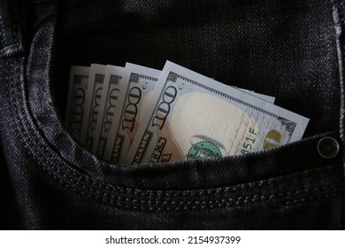 Hundred dollar bills in jeans pocket, business concept.