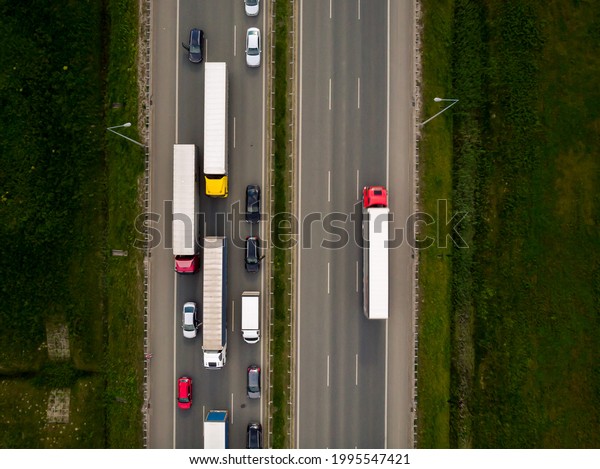 Hundreds of cars and trucks are\
in a huge traffic jam on the A2 motorway near the town of\
Stryków.