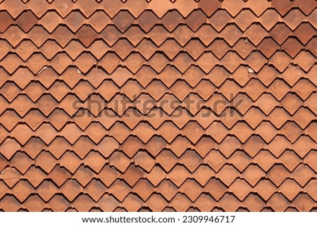 Hung clay tiles in a diamond pattern on an old house