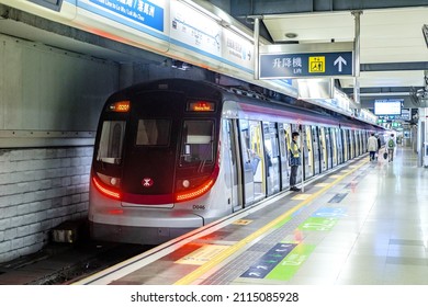 HUNG HOM, HONG KONG - FEB 24, 2018: An MTR East Rail Line metro train stopping at Hung Hom Terminus platform. This train is made by Rotem of South Korea