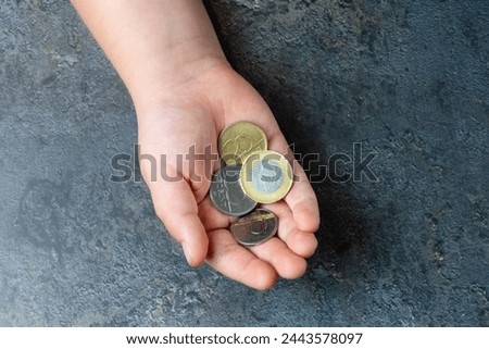 Hungarian forint coins in a hand