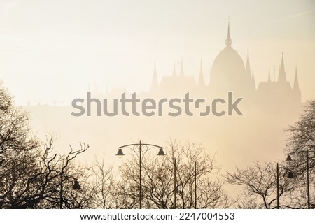 Hungarian parliament in a foggy sunrise in Budapest