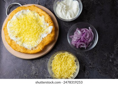 Hungarian traditional food - deep fried flatbread - Lángos - Powered by Shutterstock