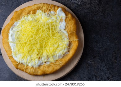 Hungarian traditional food - deep fried flatbread - Lángos - Powered by Shutterstock