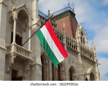 Hungarian tricolor national flag on the ornate building of the Hungarian Parliament in Budapest, Hungary